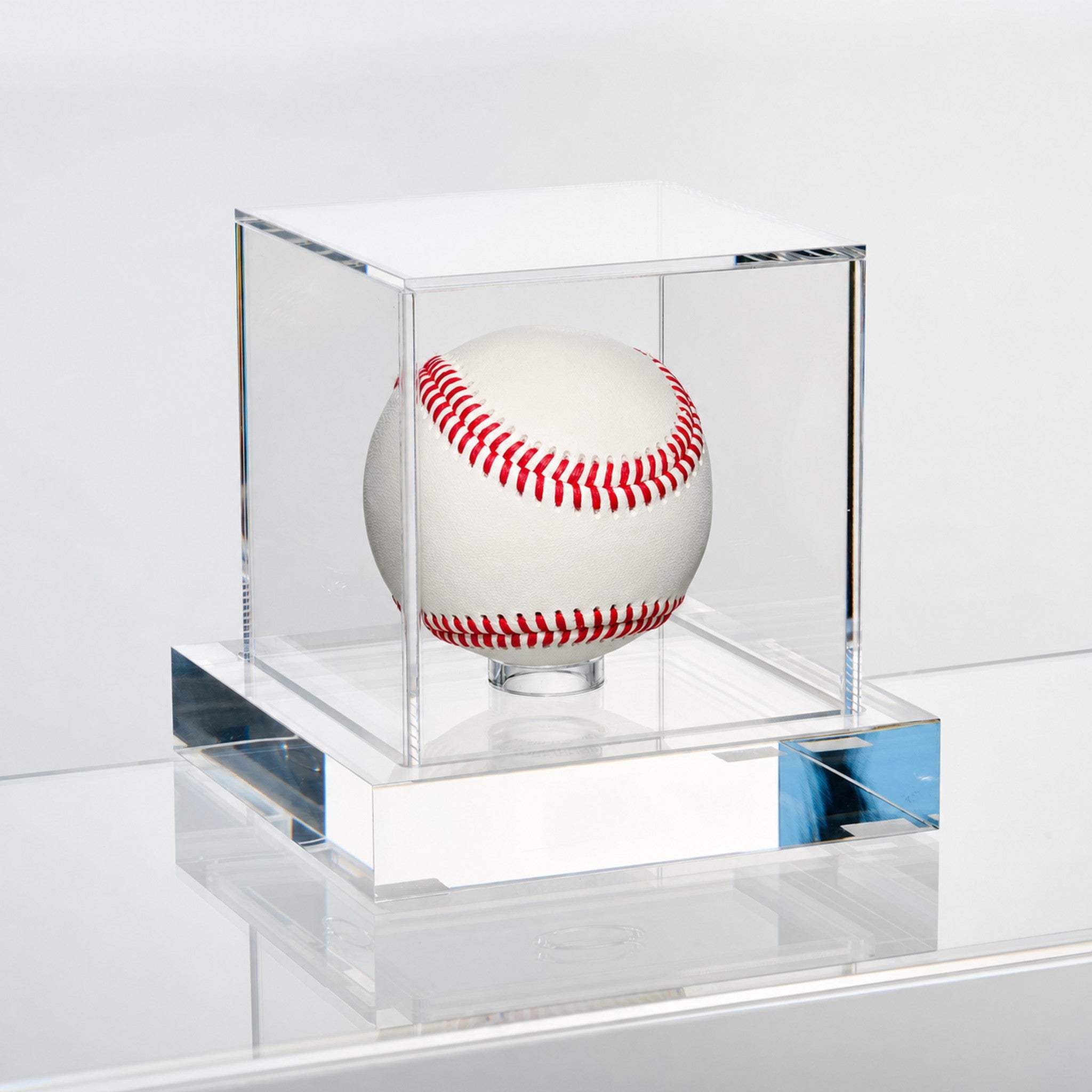 Angled view of the Wexel Art baseball display case showing the polished edges of the solid clear acrylic base