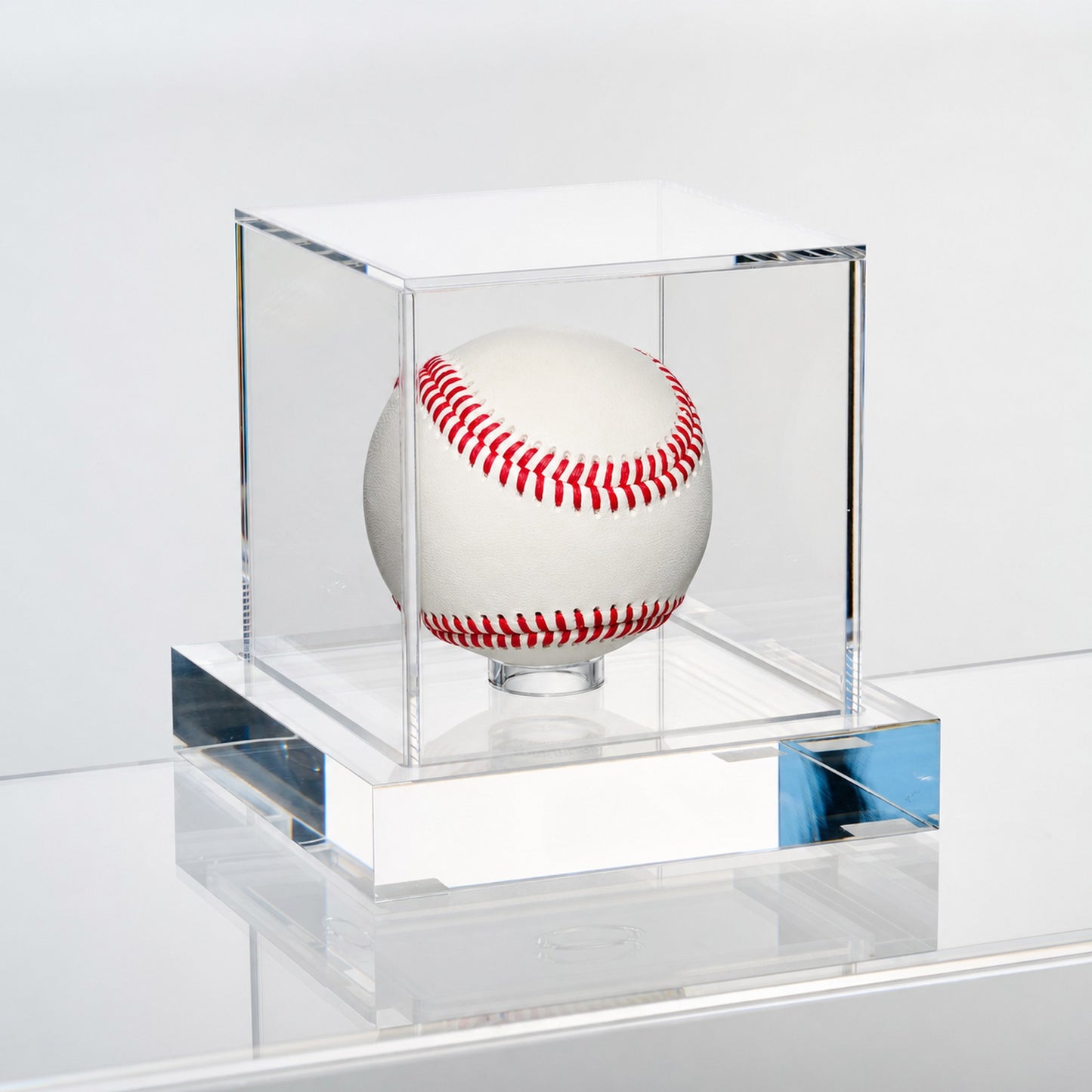 Angled view of the Wexel Art baseball display case showing the polished edges of the solid clear acrylic base