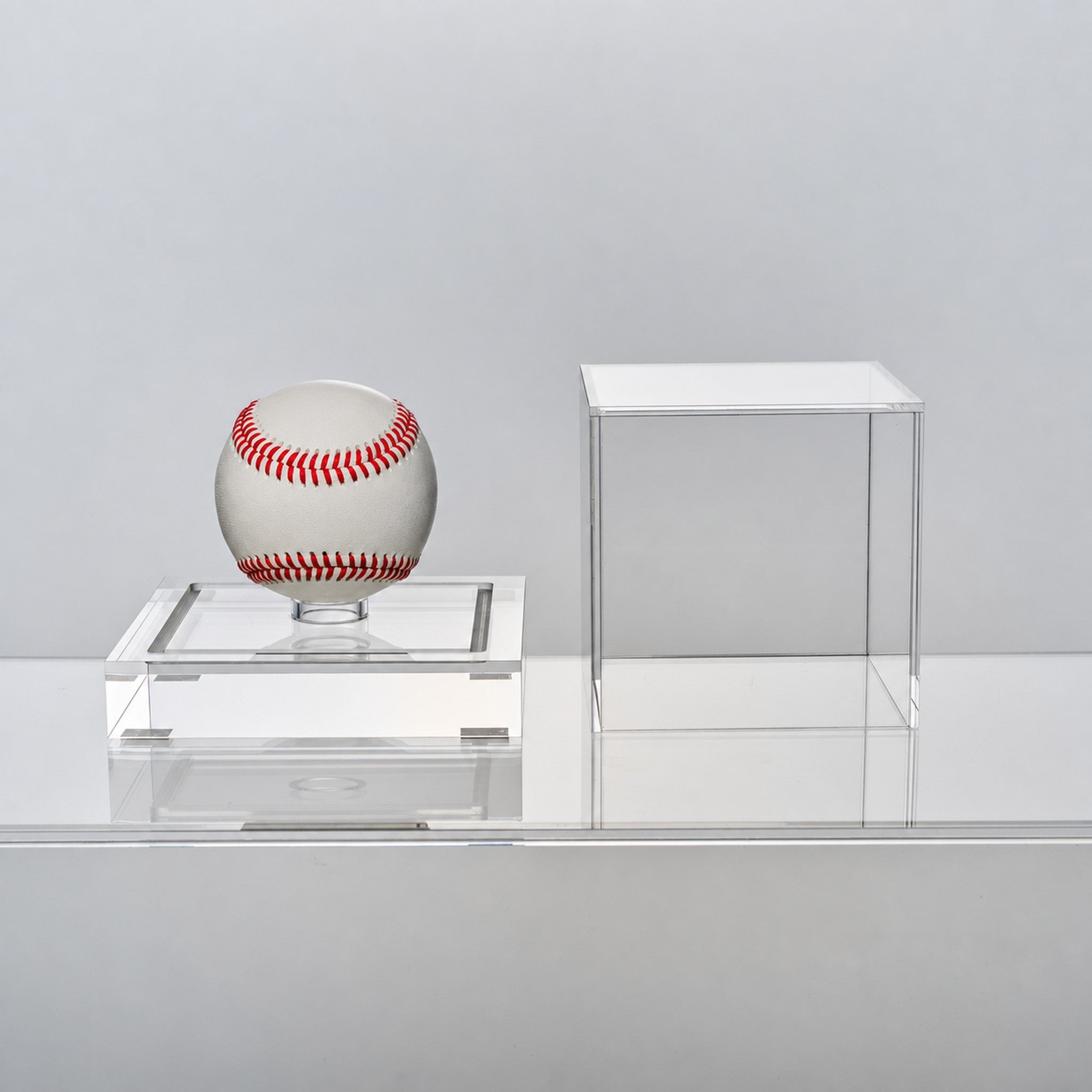 Baseball display case with the clear acrylic cover lifted off, showing tool-free access to the baseball