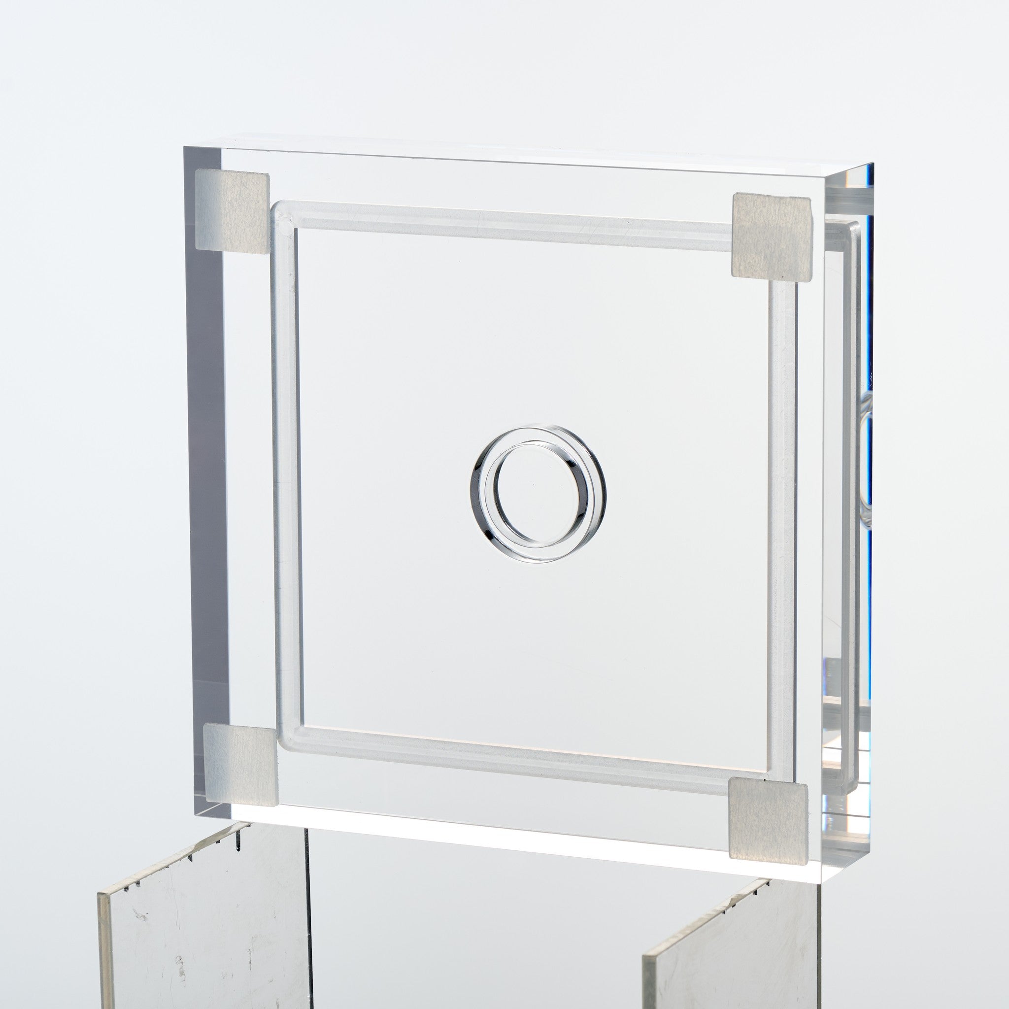 Underside of the baseball display case base showing four non-slip corner feet
