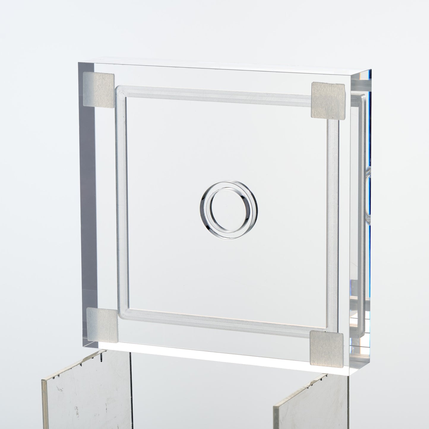 Underside of the baseball display case base showing four non-slip corner feet